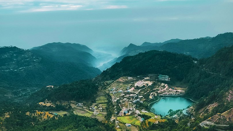 Emerald-green waters of Khurpatal Lake, one of the scenic hidden gems among the best places to visit in Nainital.