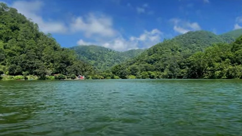 Misty morning view of Sattal Lake surrounded by dense forest, a hidden natural gem among the best places to visit in Nainital.