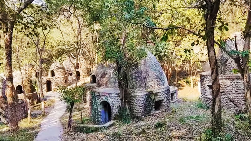 Colorful murals and meditation huts inside Beatles Ashram, a creative retreat in Rishikesh