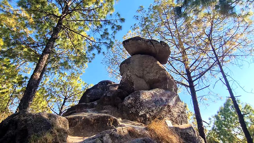 Large balancing rock formation known as Bhim Pakora, a natural wonder in Lansdowne