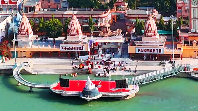 Peaceful view of Parmarth Niketan Ashram with Ganga river in the background