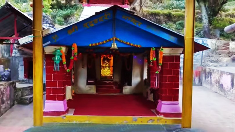Peaceful stone shrine of Vridh Badri Temple surrounded by mountains, a historic site