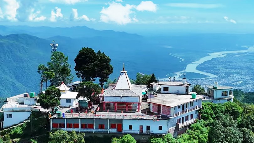 Sunrise view from Kunjapuri Devi Temple hilltop with Himalayan peaks in the distance