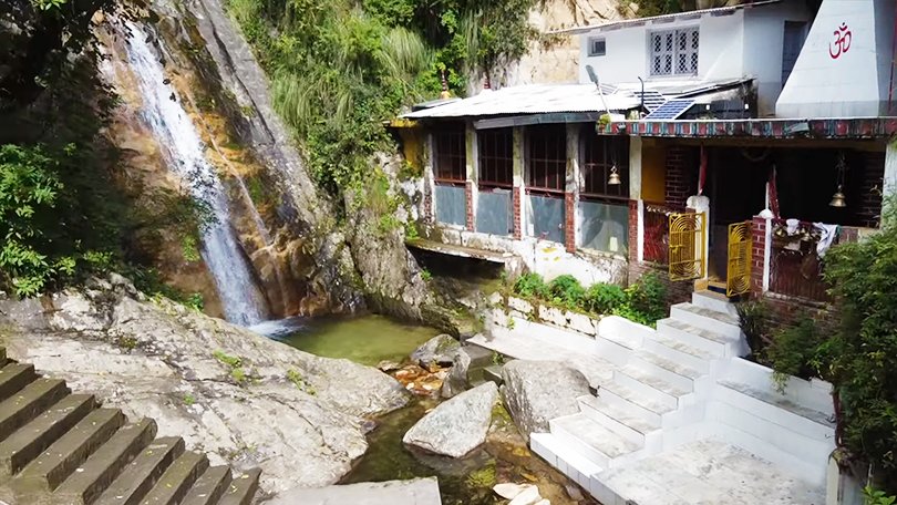 Rudradhari Waterfalls and caves surrounded by forests on Kausani to Almora trekking route