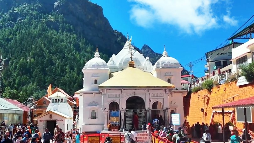 Gangotri Dham temple surrounded by mountains, an important stop in Char Dham Yatra 2025.