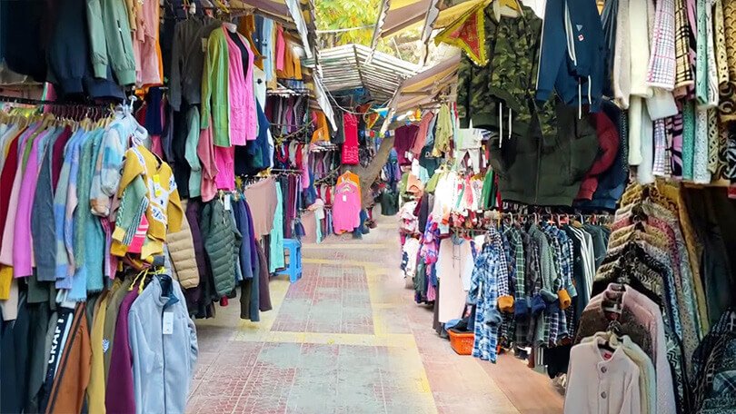 Colorful Tibetan Market near Mall Road selling clothes and souvenirs in Nainital
