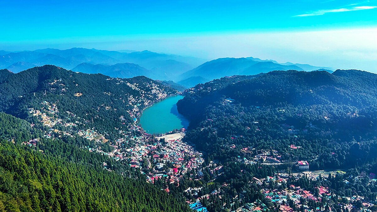 Panoramic view of Nainital town with Naini Lake and surrounding hills
